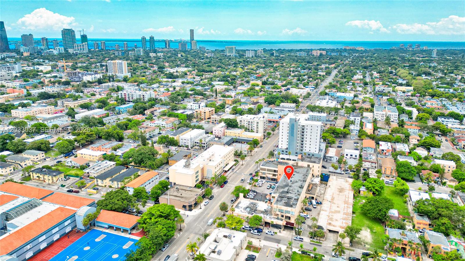 An aerial view shows a city neighborhood with a red map pin on a building — 340 SW 12 Ave, Miami FL 33130, MIAMI, FL