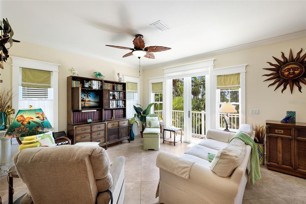 An entryway features a tiled floor with a compass rose inlay, stairs, and double doors — 309 68TH STREET, HOLMES BEACH, FL