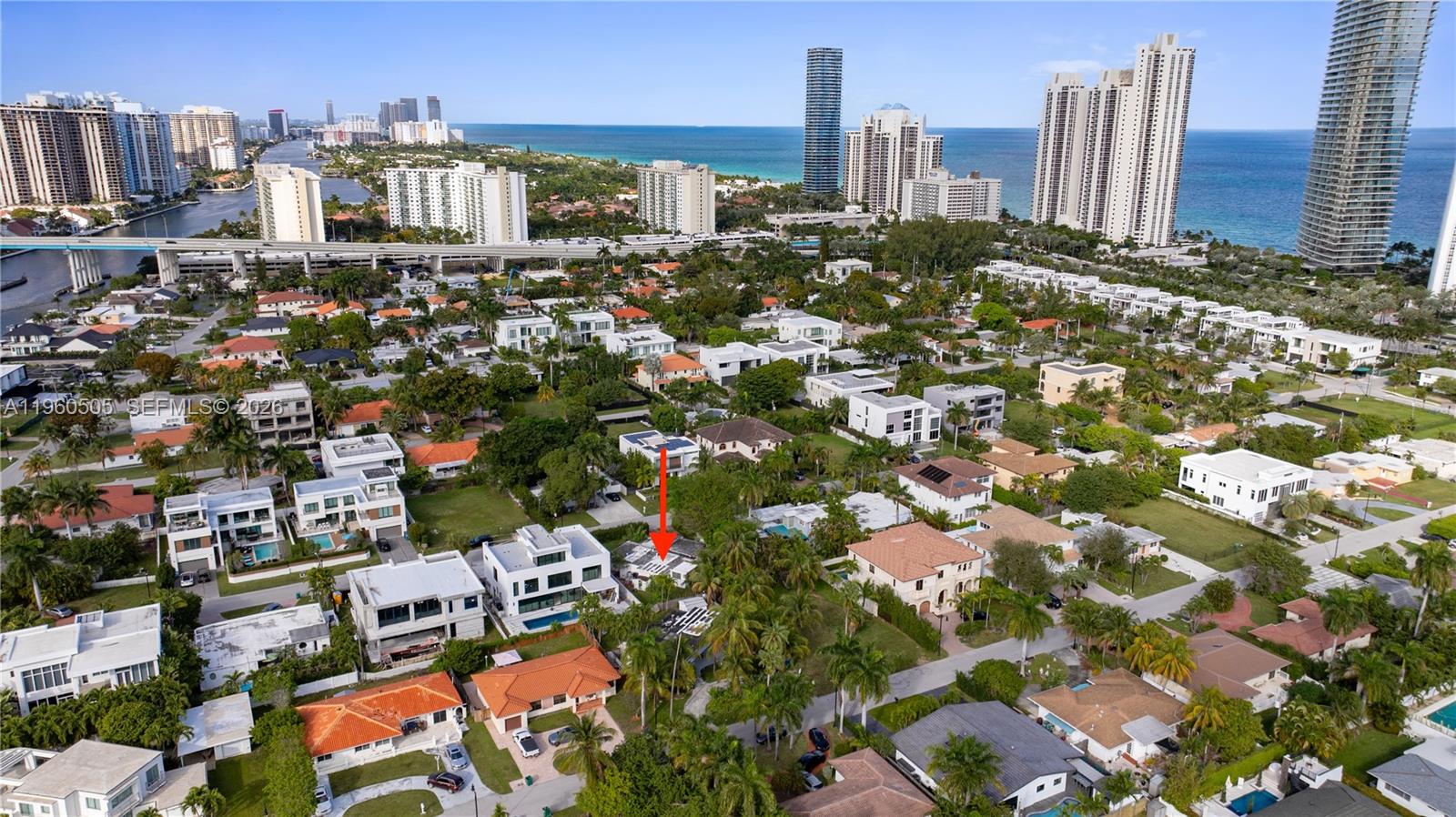 An aerial view shows a residential neighborhood with a red arrow pointing to a house — 322 189th St, Sunny Isles Beach FL 33160, SUNNY ISLES BEACH, FL