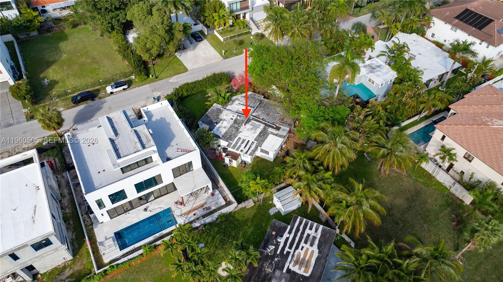 An aerial view shows a residential neighborhood with a red arrow pointing to a house — 322 189th St, Sunny Isles Beach FL 33160, SUNNY ISLES BEACH, FL