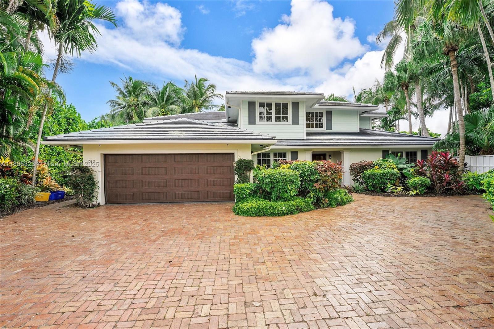 A two-story house with a brick driveway, a two-car garage, and lush tropical landscaping — 746 Marble Ct, Boca Raton FL 33432, BOCA RATON, FL