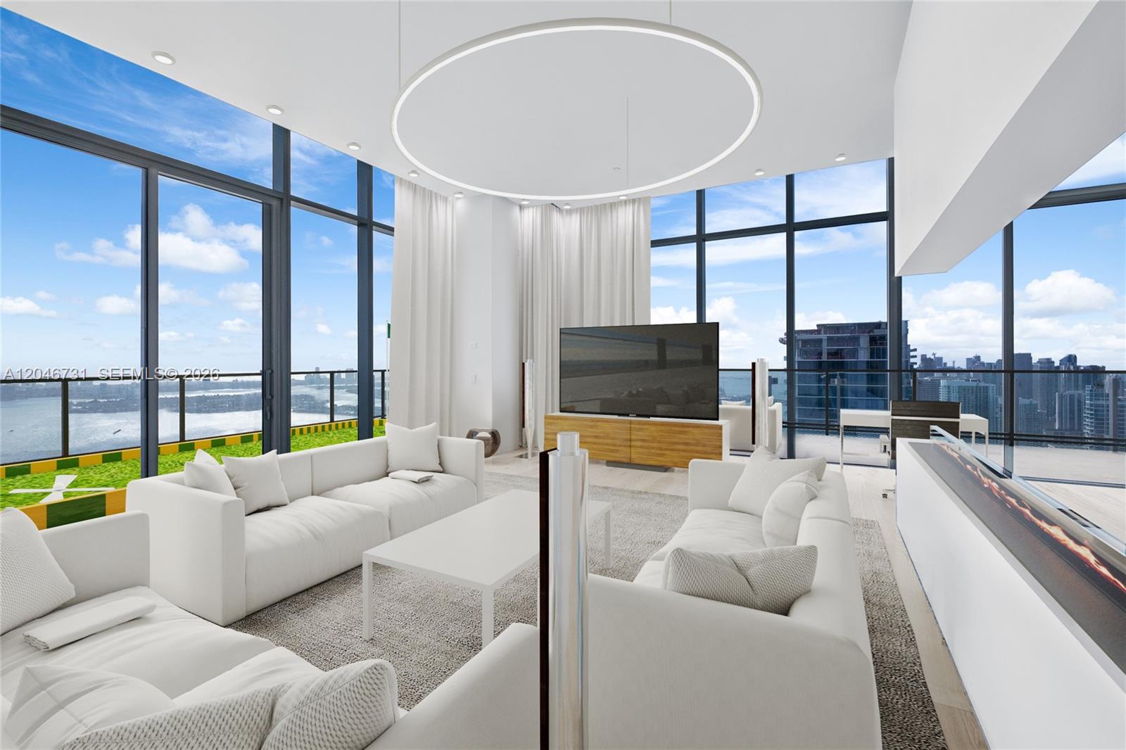This modern living room features floor-to-ceiling windows, white sofas, and a circular ceiling light — 700 NE 26th Ter # 02, Miami FL 33137, MIAMI, FL
