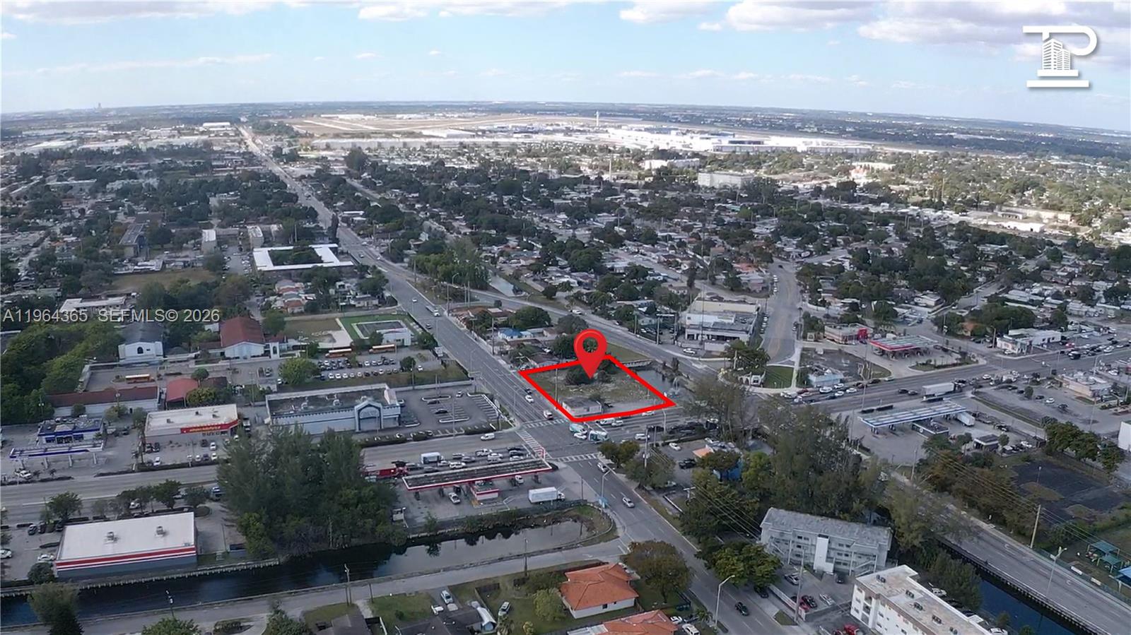 An aerial view shows a vacant corner lot outlined in red within a suburban neighborhood — 13510 NW 27th Ave, Opa-Locka FL 33054, OPA-LOCKA, FL