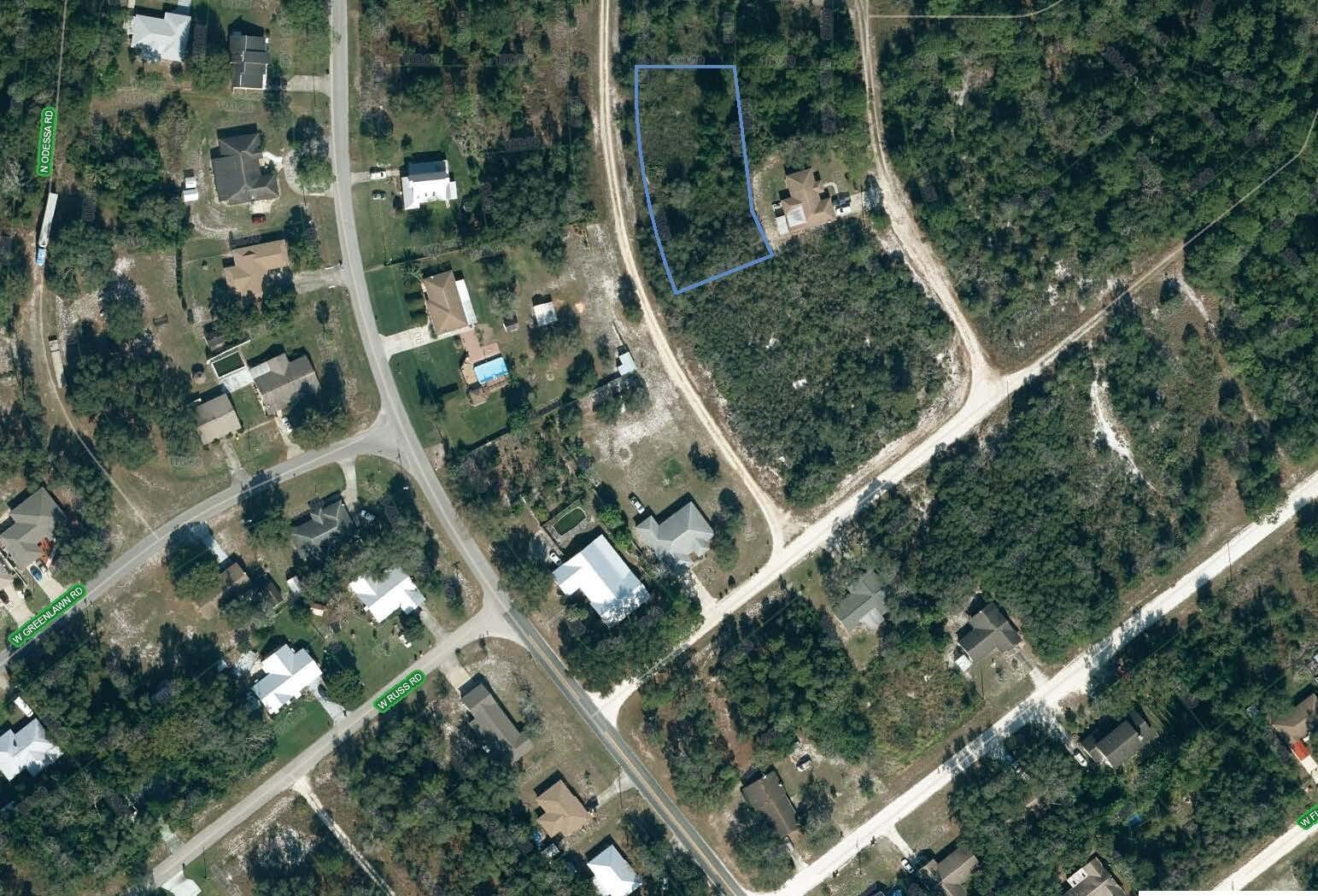 An aerial map view shows a rectangular plot of land outlined in blue — 2610 N Colman Road, FL 33825, FL