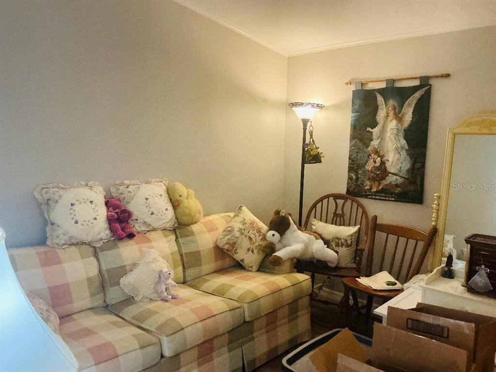 The exterior of a mobile home features a gravel yard, a landscaped garden, and lighting — 10325 MARINETTE, HUDSON, FL