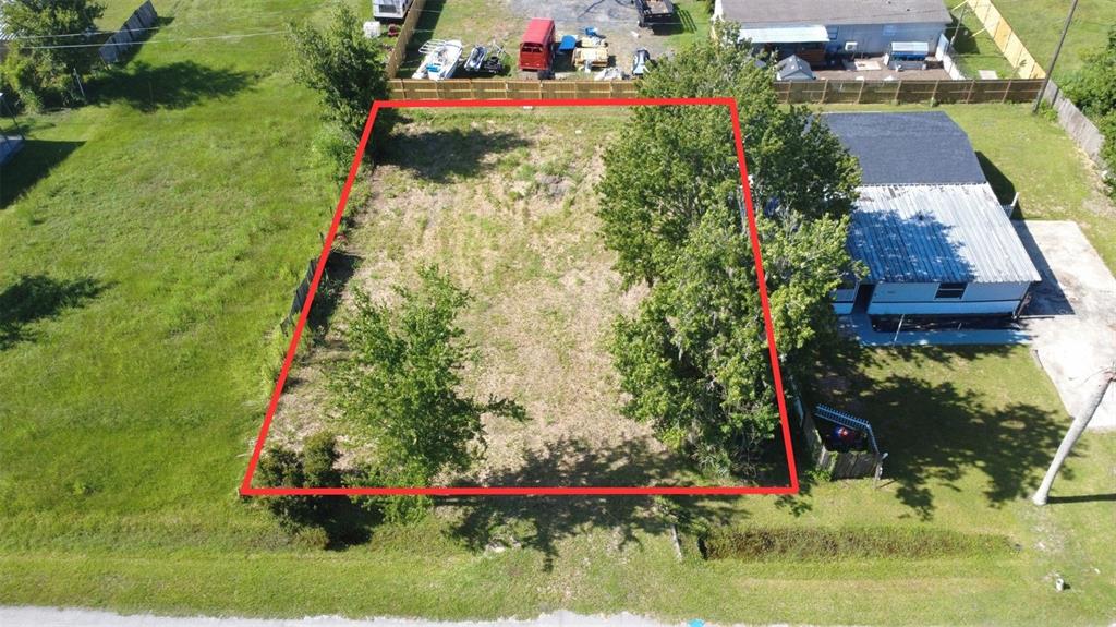 An aerial view shows a rectangular vacant lot outlined in red next to a house — 3RD AVENUE, ORLANDO, FL