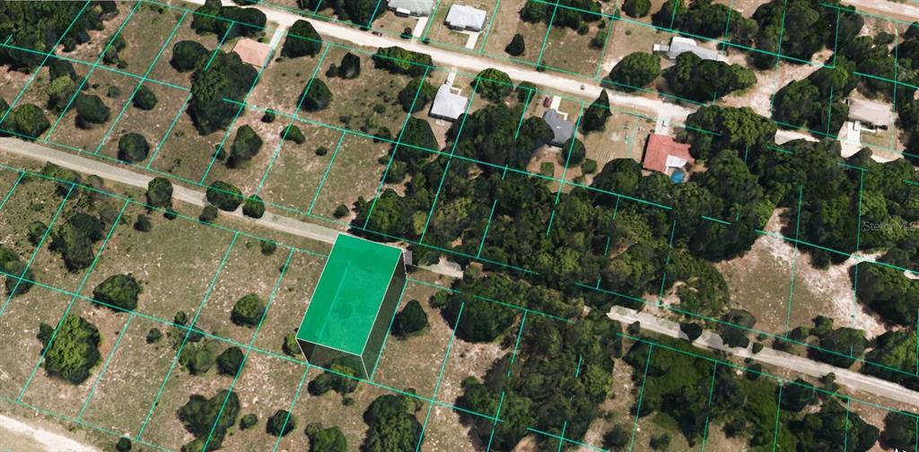 An aerial view shows a vacant, rectangular lot highlighted in green within a residential neighborhood — 2314 GARFIELD STREET, INVERNESS, FL