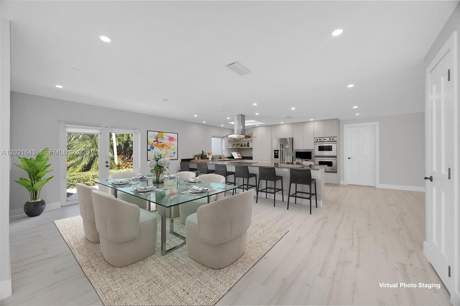 A swimming pool sits on a stone patio surrounded by lounge chairs and tropical landscaping — 8303 Old Cutler Rd, Coral Gables FL 33143, CORAL GABLES, FL
