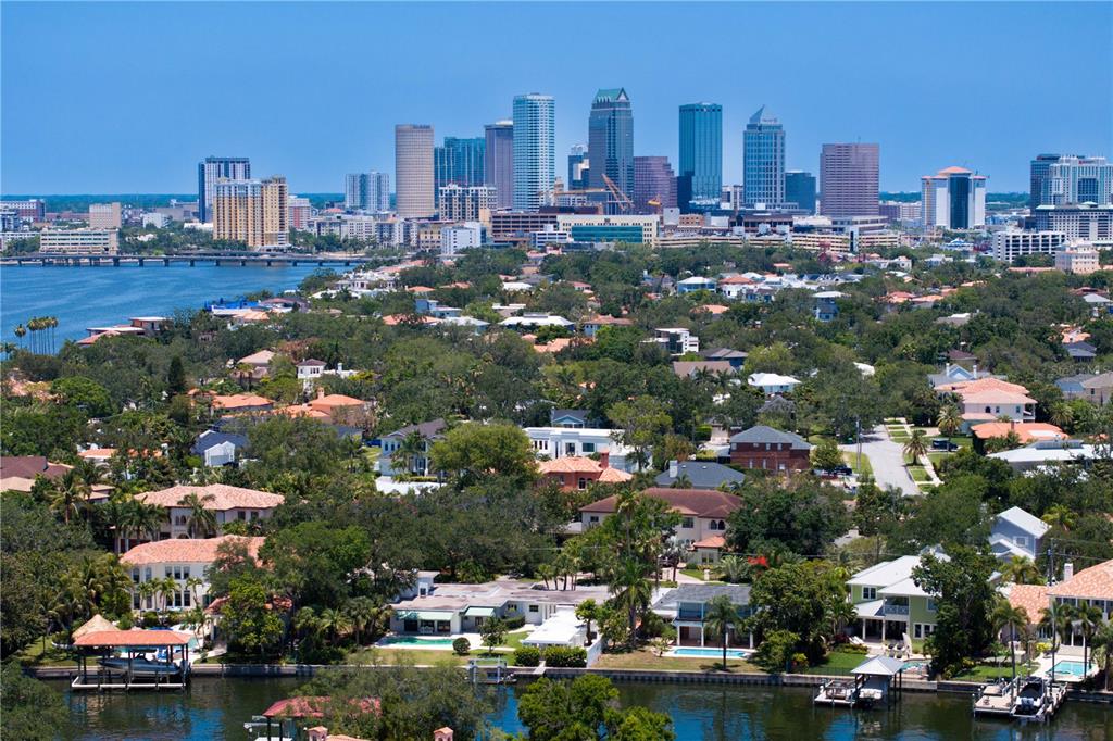 An aerial view of a waterfront residential neighborhood with the Tampa city skyline in background — 508 E DAVIS BOULEVARD, TAMPA, FL