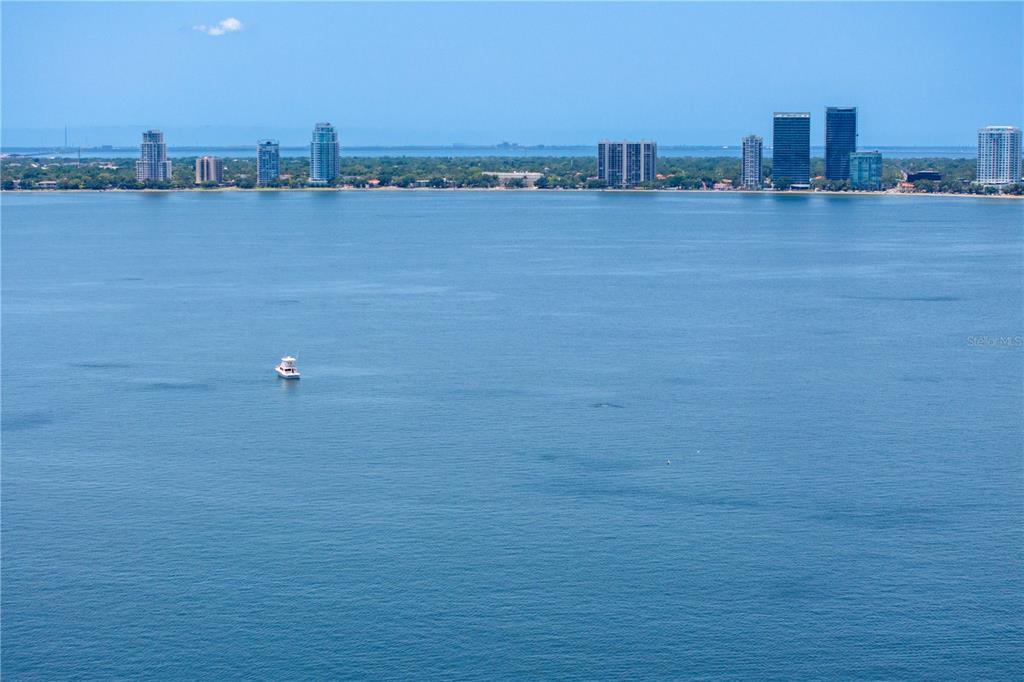 An aerial view of a large body of water with a boat and distant buildings — 508 E DAVIS BOULEVARD, TAMPA, FL