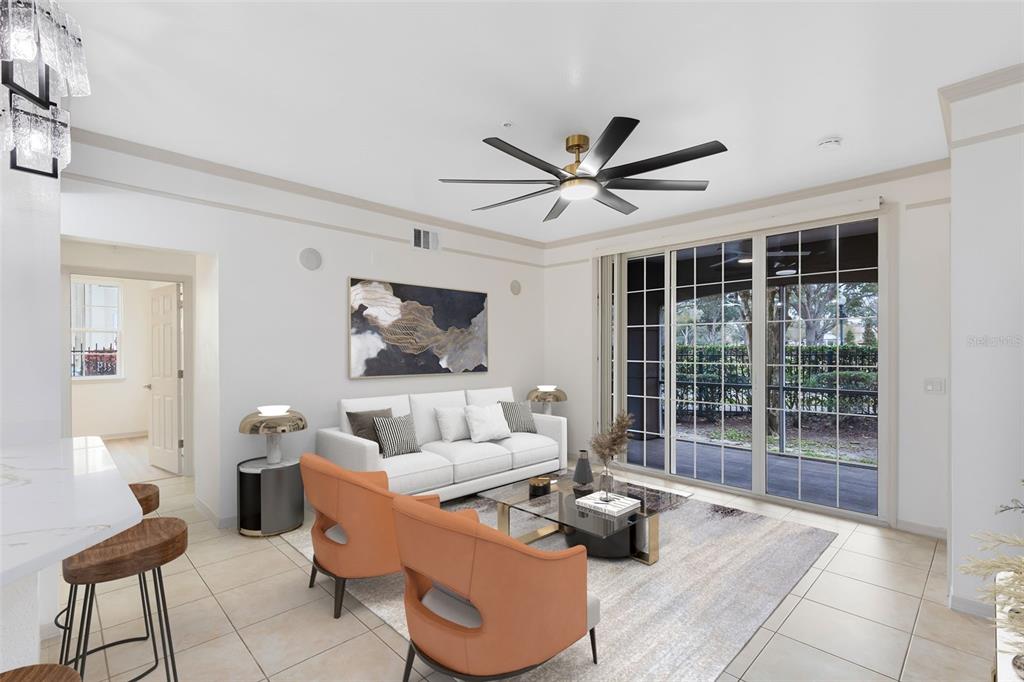 A living room features a white sofa, two orange chairs, a glass coffee table, and sliding doors — 3315 PARKCHESTER SQUARE BOULEVARD UNIT 102, ORLANDO, FL