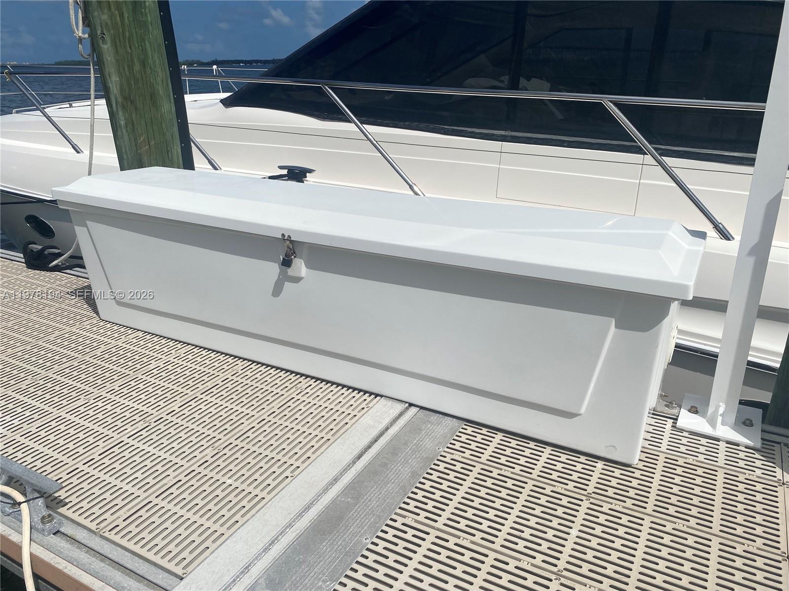 A white storage box sits on a dock next to a boat — 1901 Brickell Ave Slip 29A, Miami FL 33129, MIAMI, FL