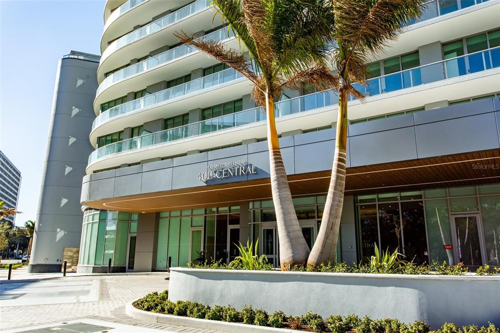 A modern kitchen features white cabinetry, stainless steel appliances, and a large central island — 400 CENTRAL AVENUE UNIT 2906, ST PETERSBURG, FL