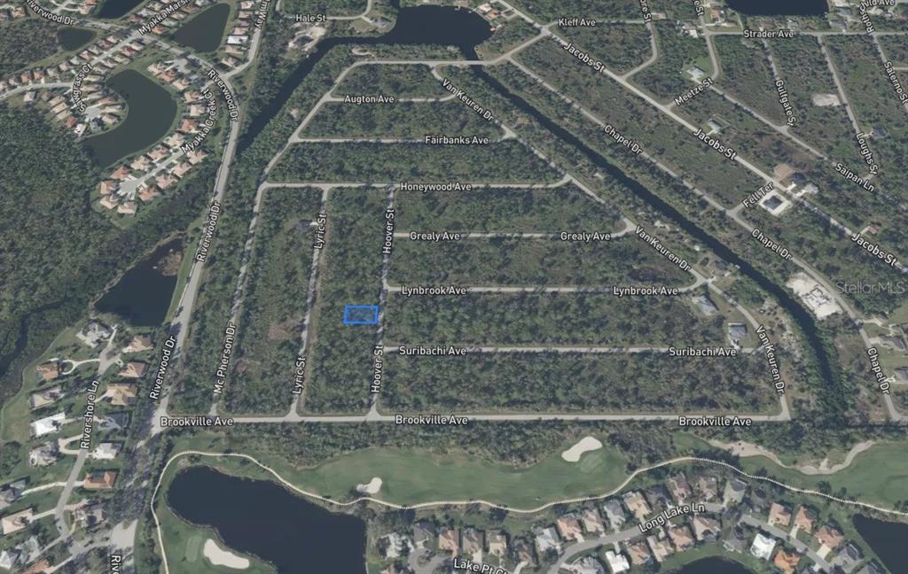 An aerial map view shows a highlighted rectangular lot within a wooded residential neighborhood — 2473 HOOVER STREET, PORT CHARLOTTE, FL
