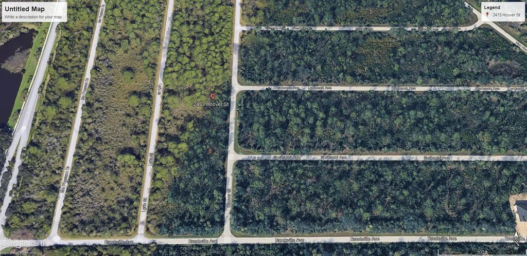 This is a satellite map view of a wooded, undeveloped residential lot — 2473 HOOVER STREET, PORT CHARLOTTE, FL