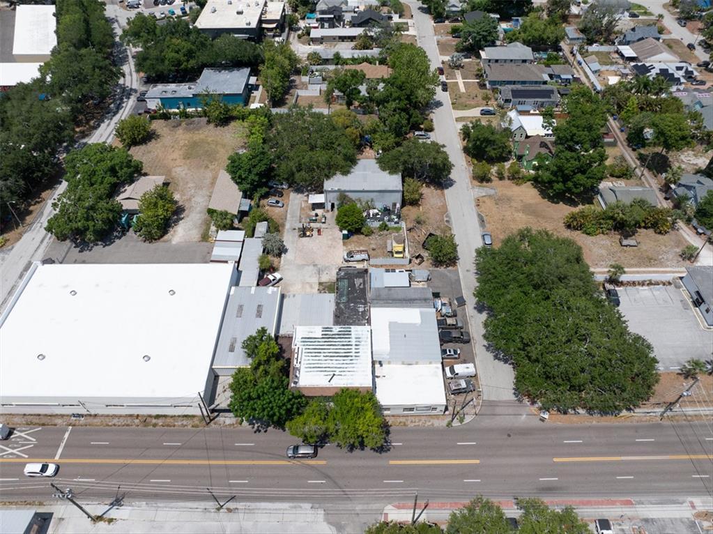 An aerial view of a commercial property with a red location pin in a city — 1763 9TH AVENUE N, ST PETERSBURG, FL