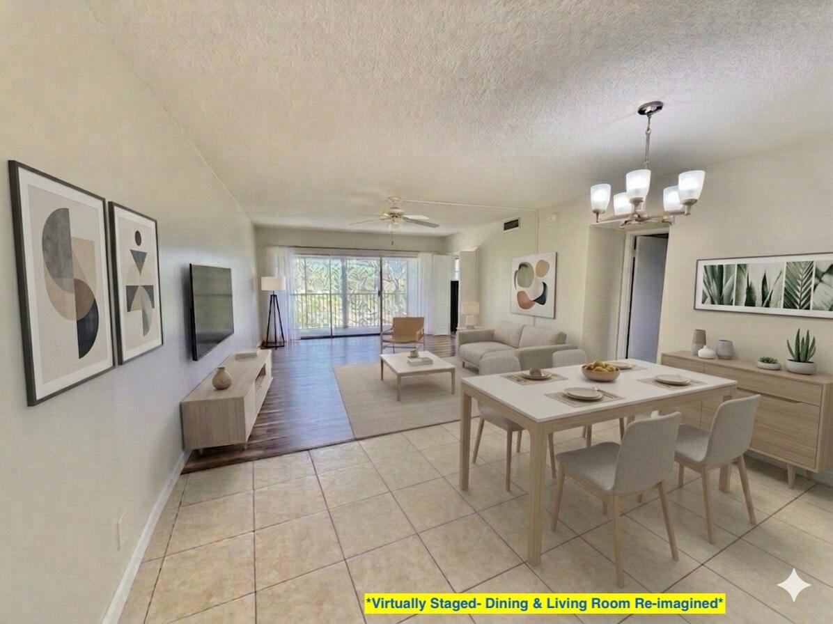 This virtually staged living and dining room features tile flooring, a chandelier, and sliding doors — 2800 N Palm Aire Drive Unit 404, Pompano Beach FL 33069, POMPANO BEACH, FL