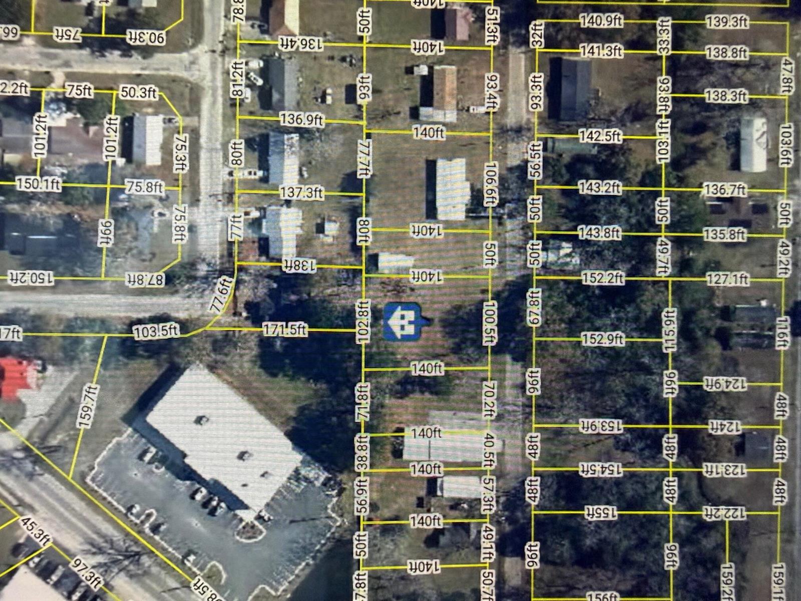 This is an aerial map showing property lot lines and dimensions for a residential area — 1026 Washington Avenue, FL 32440, FL