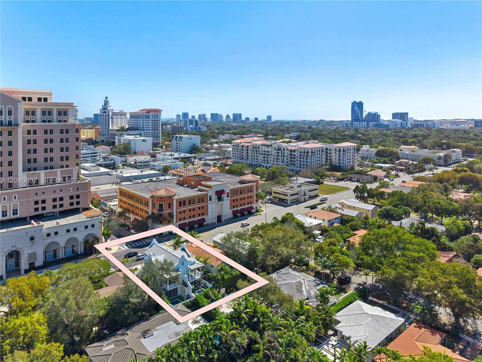 An aerial view shows a house highlighted by a pink border in a suburban neighborhood — 2712 S Le Jeune Rd, Coral Gables FL 33134, CORAL GABLES, FL