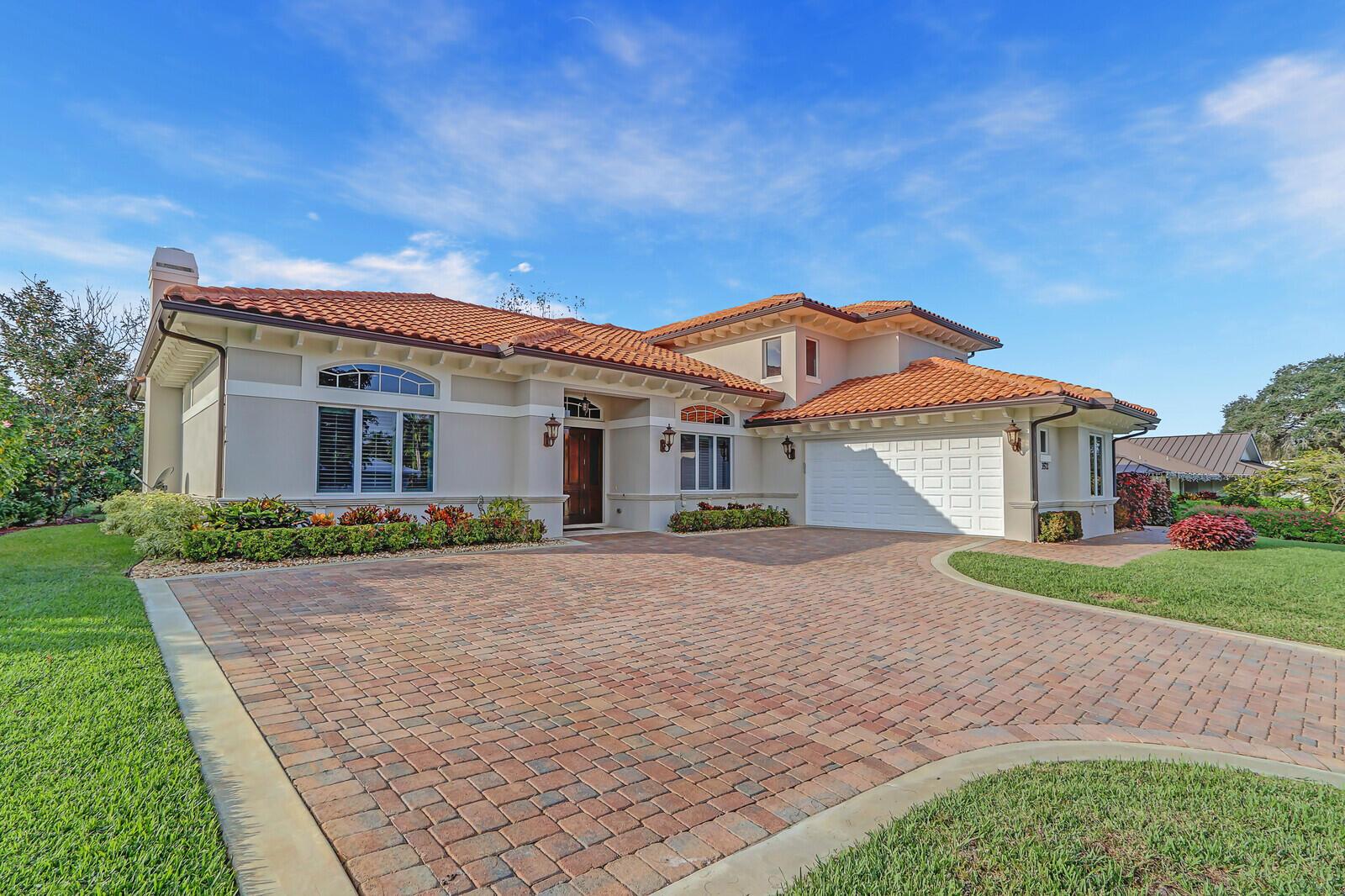 A single-story house with a terracotta tile roof and a brick paver driveway — 3572 SE Court Drive, Stuart FL 34997, STUART, FL