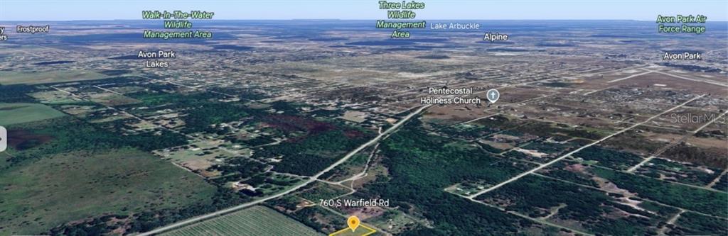 This is an aerial map view showing a plot of land and surrounding rural landscape — 760 S WARFIELD ROAD, AVON PARK, FL