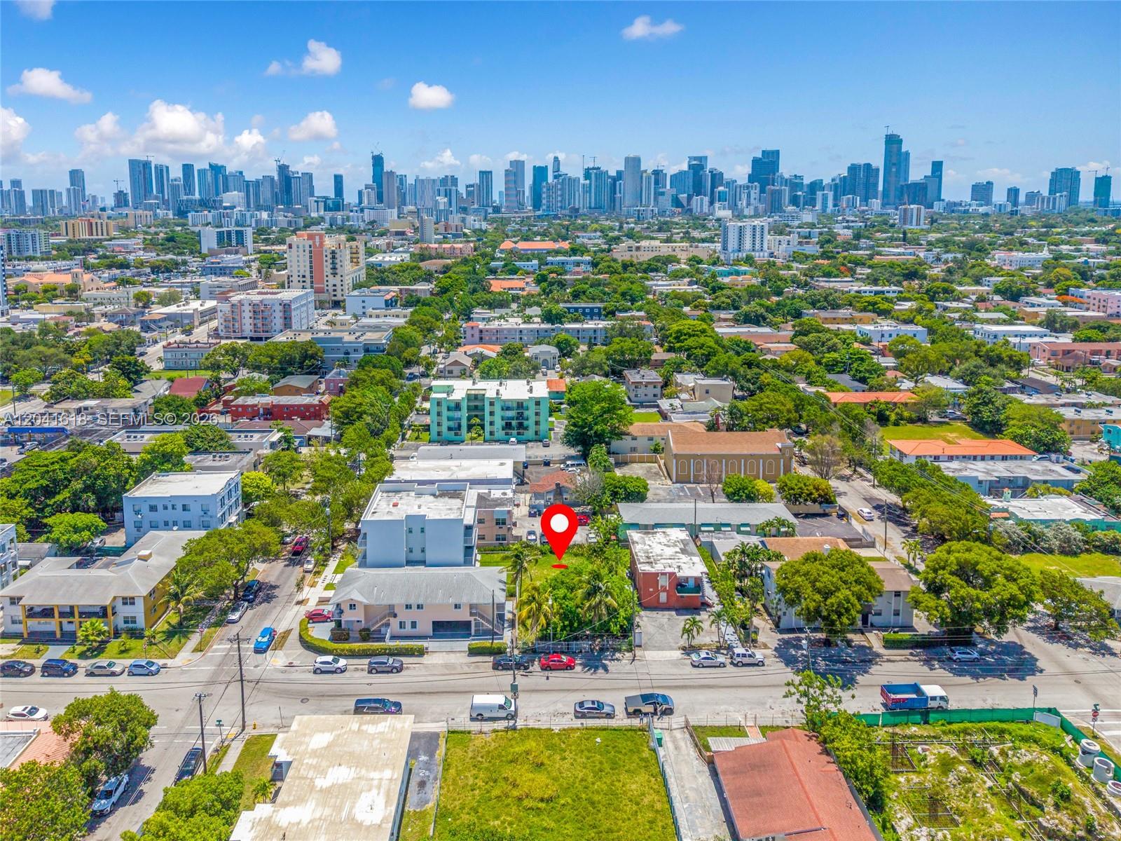 An aerial view shows a vacant, tree-filled lot marked with a red pin in Miami — 219 SW 16th Ave, Miami FL 33135, MIAMI, FL