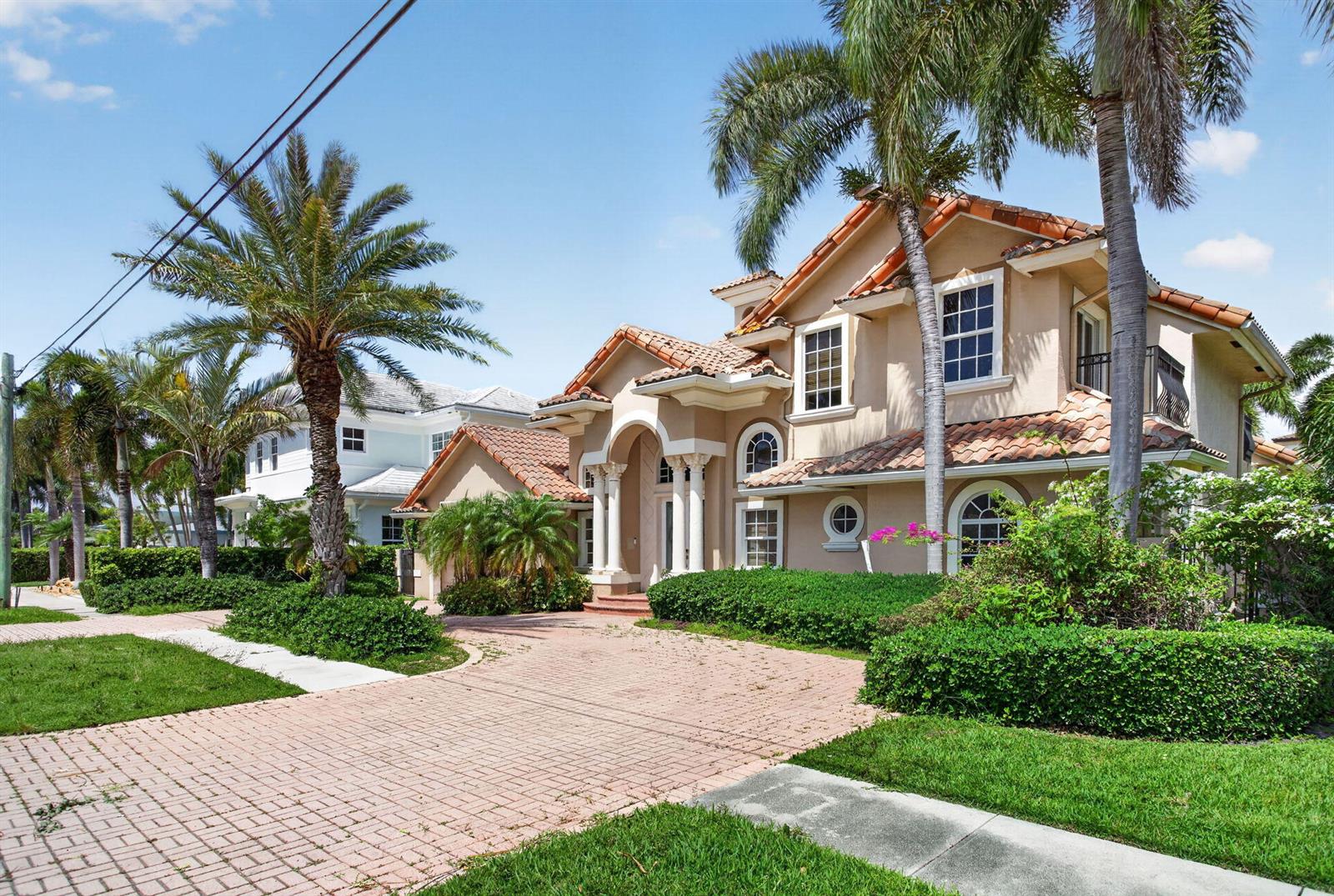 A two-story stucco house with a tile roof and a brick paver driveway — 4901 NE 29th Avenue, Lighthouse Point FL 33064, LIGHTHOUSE POINT, FL
