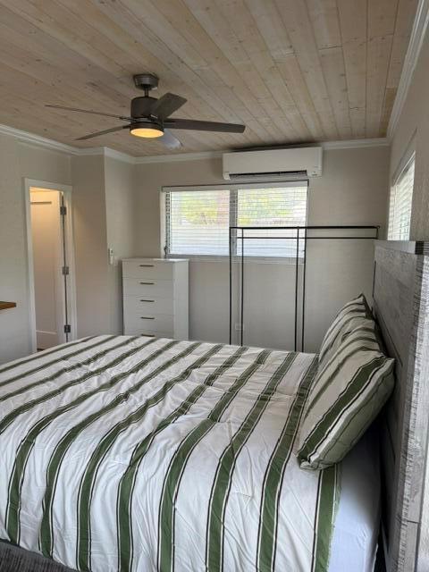 A bedroom features a striped comforter, a white dresser, and a wood-paneled ceiling — 131 S Federal Highway # 3, FL 33460, FL