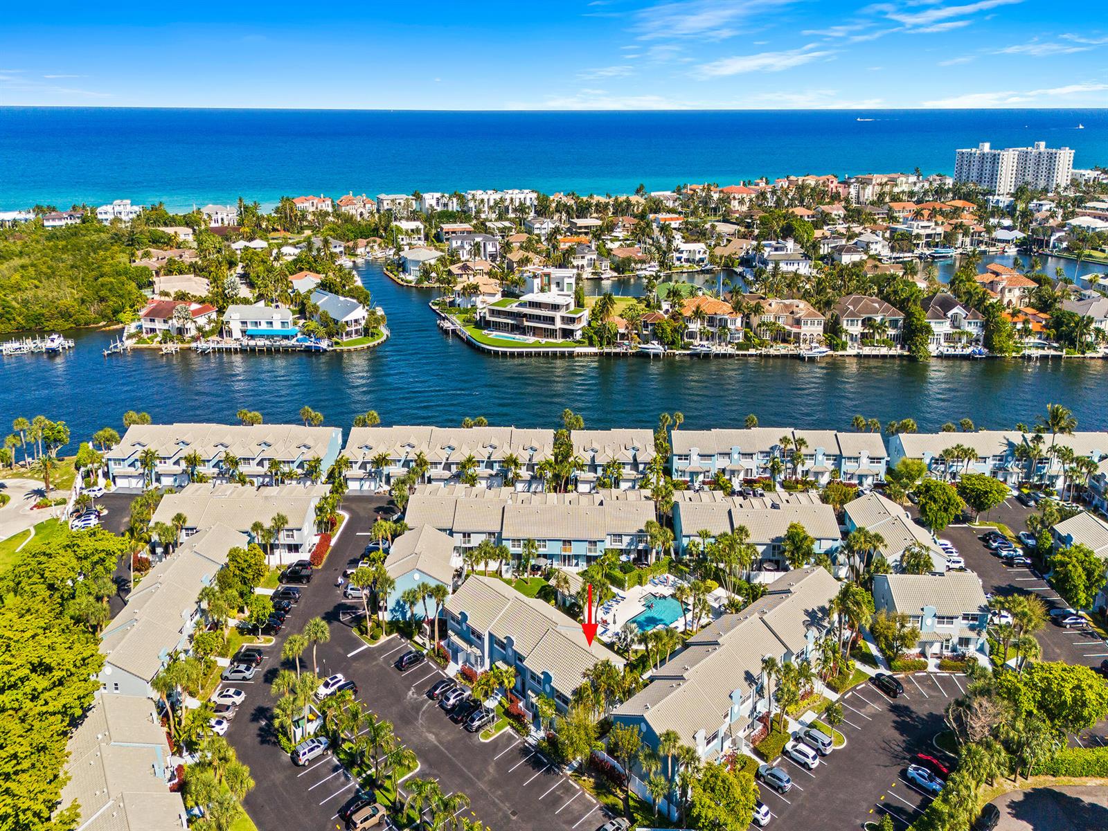 An aerial view shows a multi-unit residential complex with a pool near a waterway — 1074 Jeffery Street, Boca Raton FL 33487, BOCA RATON, FL
