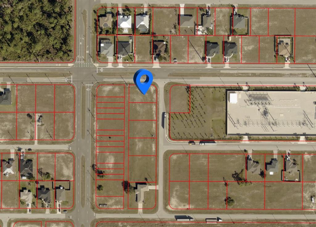 This aerial map shows a vacant residential lot marked with a blue pin — 2326 NW 15TH PLACE, CAPE CORAL, FL