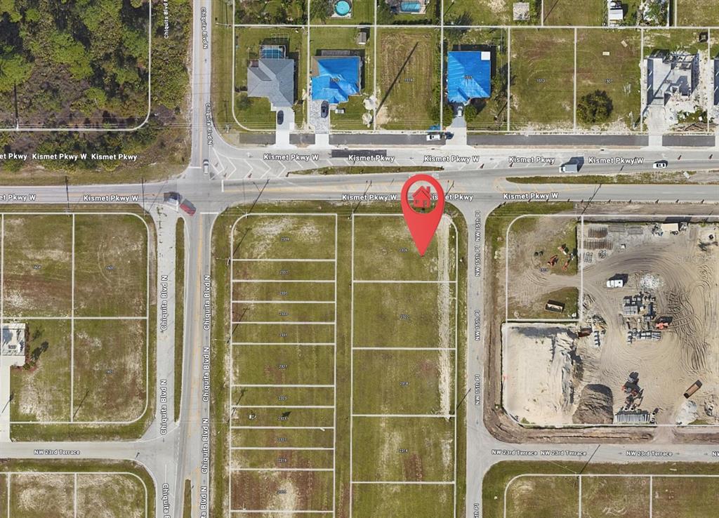 This is an aerial map showing a vacant residential lot marked with a red pin — 2326 NW 15TH PLACE, CAPE CORAL, FL
