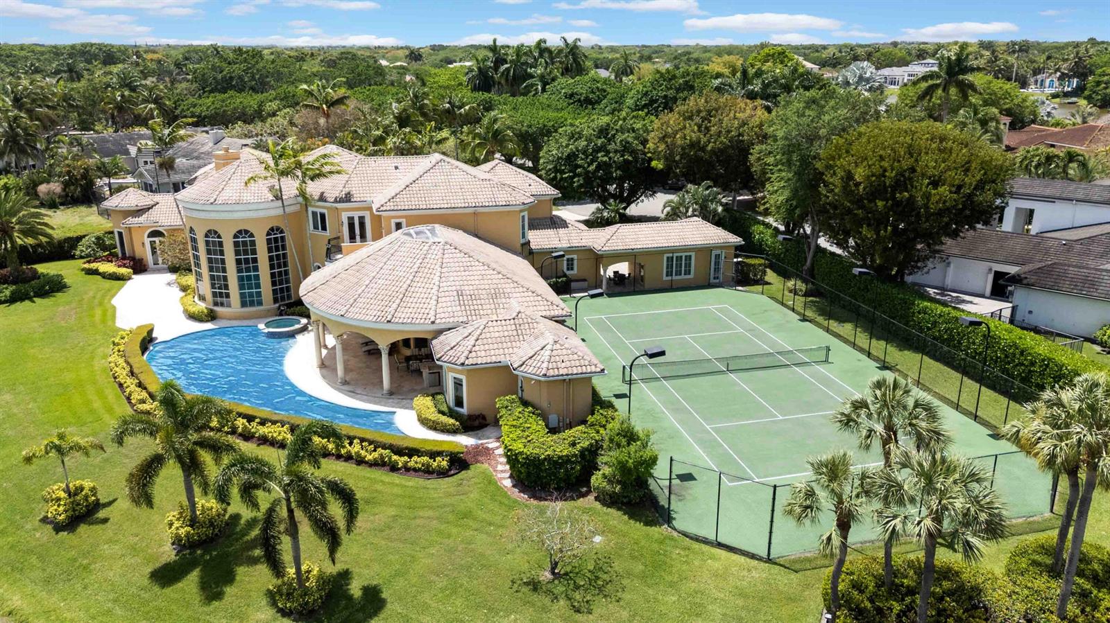 An aerial view of a large house with a swimming pool and a tennis court — 18118 Daybreak Drive, Boca Raton FL 33496, BOCA RATON, FL