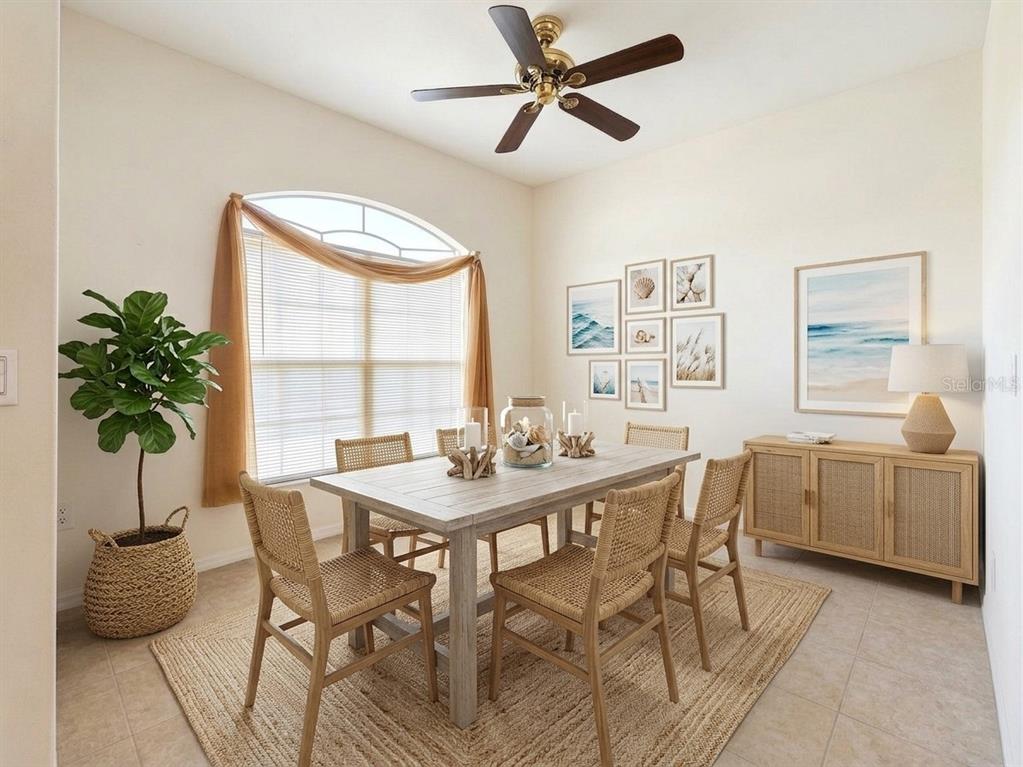 A dining room features a wooden table, woven chairs, a jute rug, and coastal wall art — 1487 EVANGELINA LANE, NORTH PORT, FL