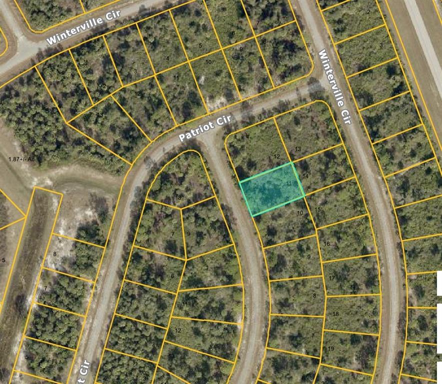 This is an aerial map showing a highlighted vacant lot located along a curved road — Lot 3 HAMBURG DRIVE, NORTH PORT, FL