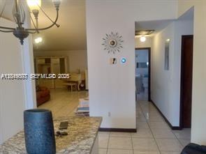 A view from a kitchen counter looking toward a living area and a hallway — 17307 SW 115th Ave, Miami FL 33157, MIAMI, FL