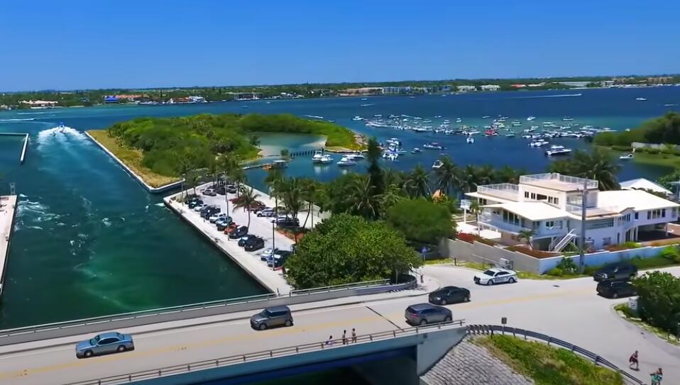 An aerial view shows a bridge, a parking lot, a waterfront house, and many boats — 4020 S Ocean Boulevard, Manalapan FL 33462, MANALAPAN, FL