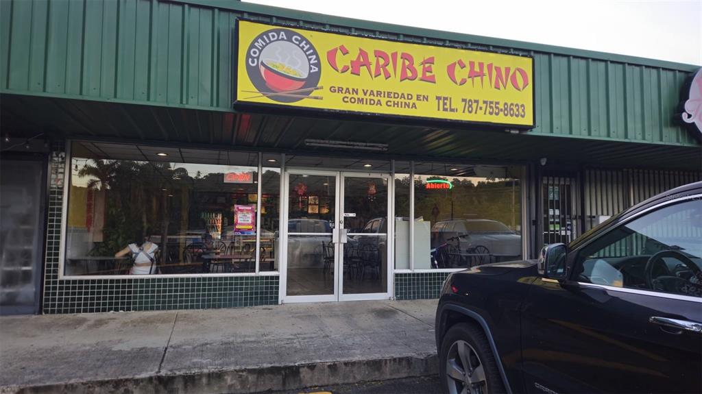 The exterior of a Chinese restaurant features a yellow sign and a glass storefront entrance — Km 11.0 PR-175, TRUJILLO ALTO, PR