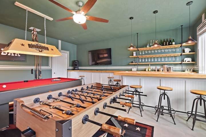 A game room features a pool table, foosball table, bar with stools, and green walls — 4542 NARRATIVE LANE, KISSIMMEE, FL