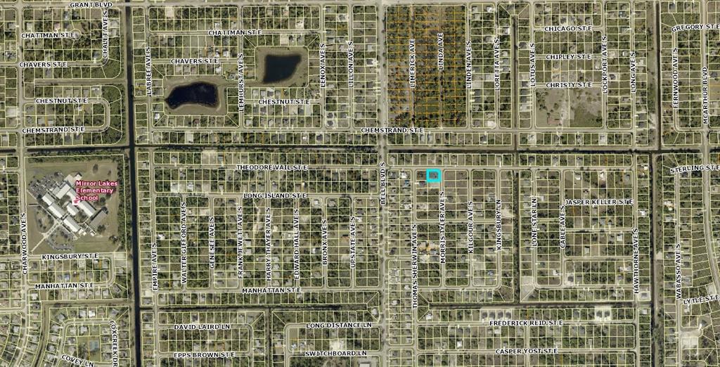 This is an aerial map showing residential lots and streets in a suburban neighborhood — 504 MORRIS TYLER AVENUE S, LEHIGH ACRES, FL