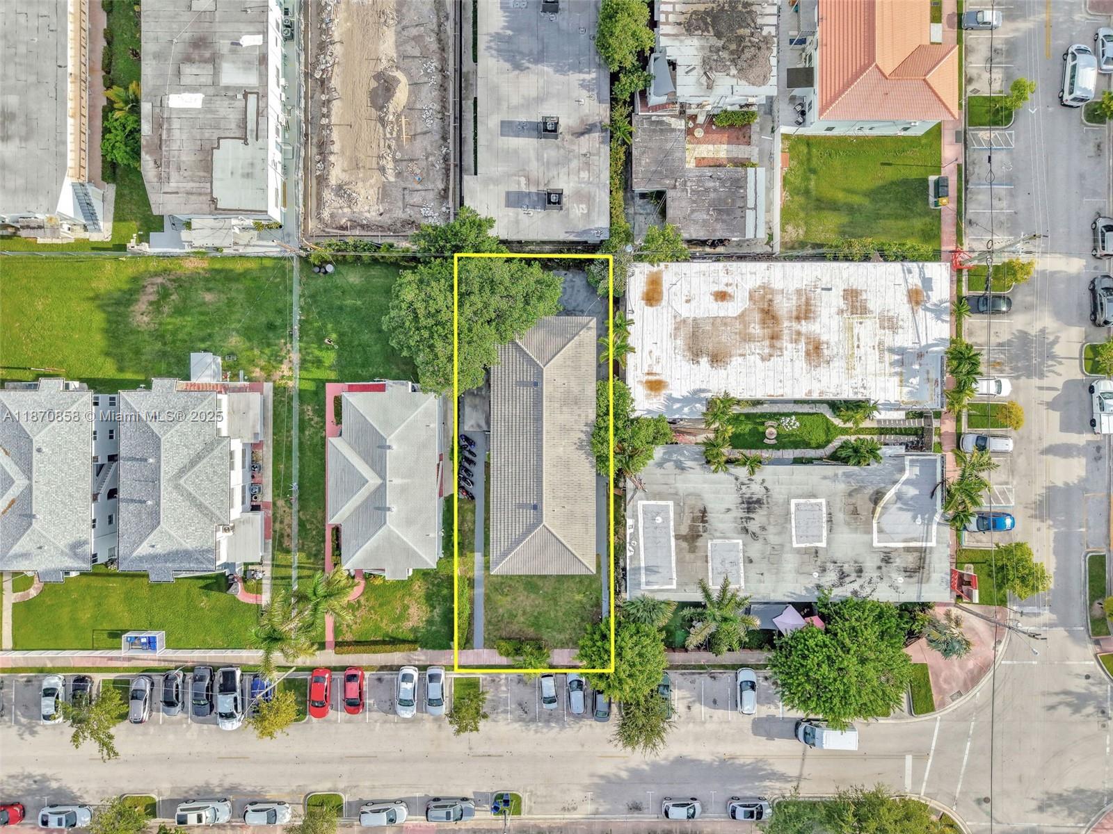 An aerial view shows a rectangular property outlined in yellow with a house and lawn — 1784 Marseille Dr, Miami Beach FL 33141, MIAMI BEACH, FL