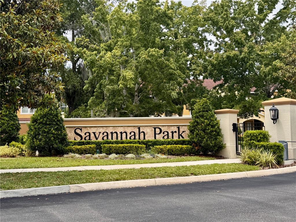 A sign for Savannah Park stands in front of a building surrounded by trees — 5335 FACTORS WALK DRIVE, SANFORD, FL