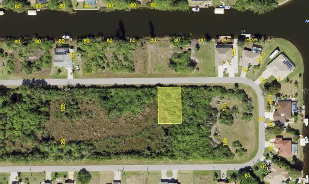 This aerial map shows a vacant rectangular residential lot highlighted in yellow — 15761 HENNIPEN CIRCLE, PORT CHARLOTTE, FL