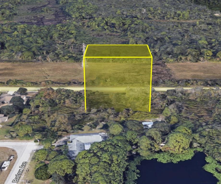 An aerial view shows a yellow highlighted rectangular area over a wooded residential lot — 4265 KINGS HWY, COCOA, FL