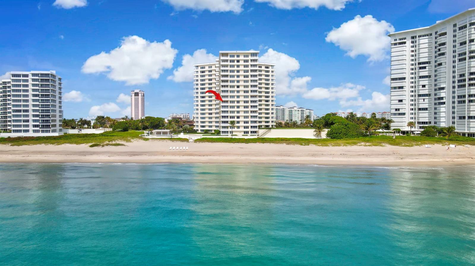 An aerial view of a tall residential building situated directly on a sandy beach — 600 S Ocean Boulevard # 6010, Boca Raton FL 33432, BOCA RATON, FL