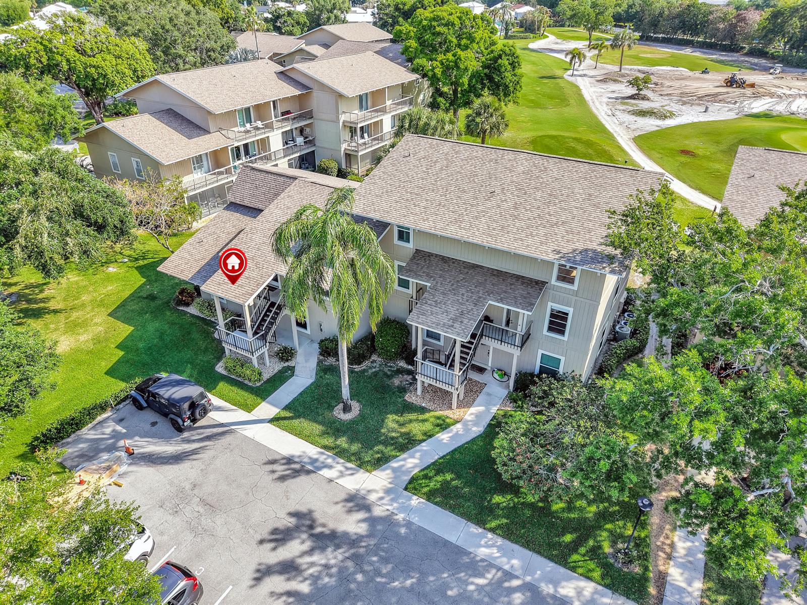An aerial view shows a multi-story apartment building with a red location pin — 18419 SE Wood Haven Lane # B, Tequesta FL 33469, TEQUESTA, FL