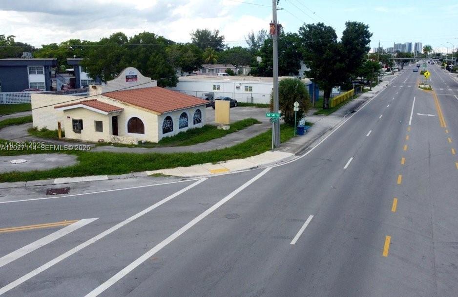 An aerial view shows a single-story commercial building with a red tile roof — 14100 W Dixie Hwy, North Miami FL 33161, NORTH MIAMI, FL