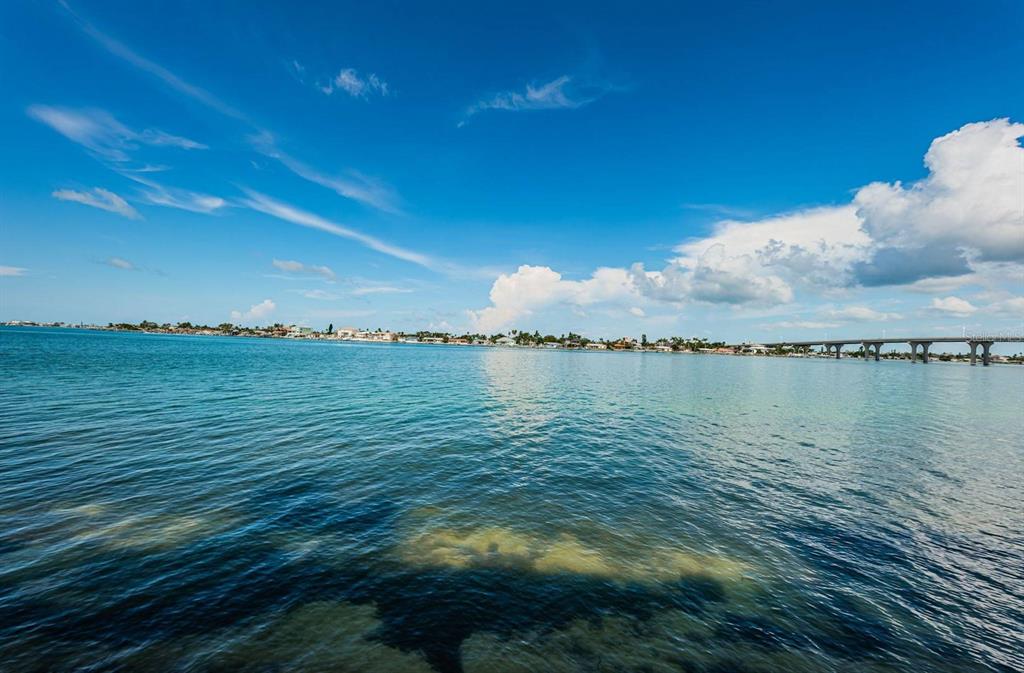A view of a calm bay with a bridge in the distance under a blue sky — 6083 BAHIA DEL MAR CIRCLE UNIT 159, ST PETERSBURG, FL