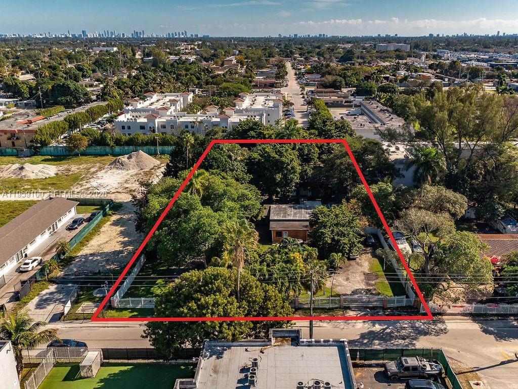 An aerial view shows a rectangular lot outlined in red containing a house and trees — 13265 Alexandria Dr, Opa-Locka FL 33054, OPA-LOCKA, FL