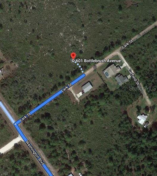 This is a satellite map showing a property location with street names and highlighted routes — 601 BOTTLEBRUSH AVENUE, LAKE PLACID, FL