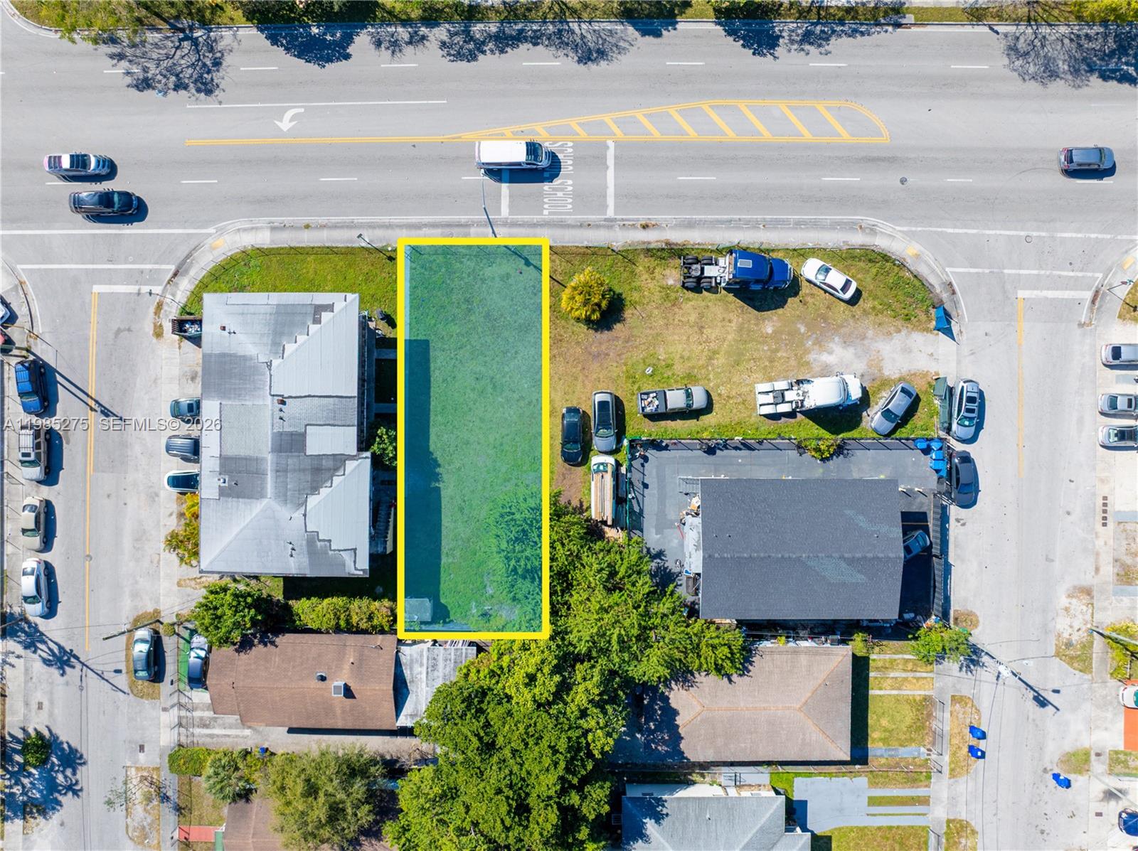 An aerial view shows a rectangular vacant lot highlighted in yellow between two existing buildings — 6425 NW 12th Ave, Miami FL 33150, MIAMI, FL